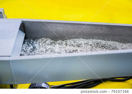 Water flow with recycled plastic granules, pellets - plastic recycling machine Water flow with recycled plastic granules, pellets - plastic recycling machine 79107166