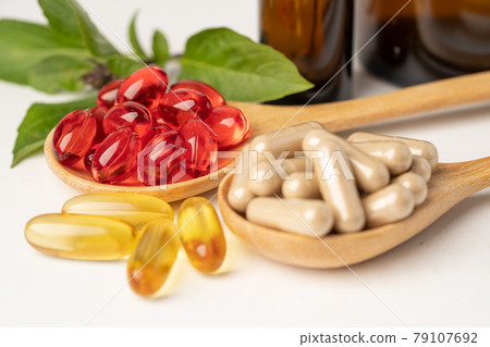 Alternative medicine herbal organic capsule with vitamin E omega 3 fish oil, mineral, drug with herbs leaf natural supplements for healthy good life.. Alternative medicine herbal organic capsule with vitamin E omega 3 fish oil, mineral, drug with herbs leaf natural supplements for healthy good life.. 79107692