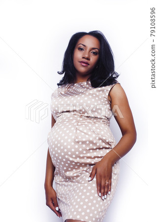 young pretty pregnant african american woman emotional posing isolated on white background, lifestyle people concept young pretty pregnant african american woman emotional posing isolated on white background, lifestyle people concept 79108596