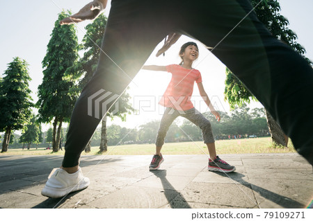 asian father and daughter do exercises catch and play together asian father and daughter do exercises catch and play together 79109271