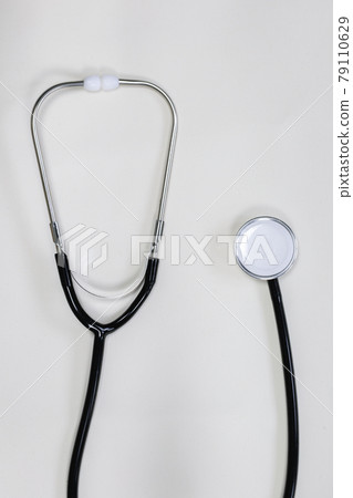 Stethoscope black top view on white background, medical instrument doctor copy space Stethoscope black top view on white background, medical instrument doctor copy space 79110629