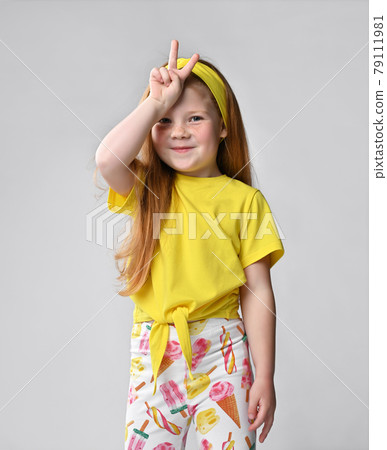 Funky smiling little red-haired girl child studio Funky smiling little red-haired girl child studio 79111981
