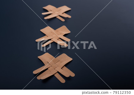 Tapes for face beautifully lie on a black background. Kineziotape for rejuvenation. tape to help fight wrinkles. Surgical rejuvenation. 79112350