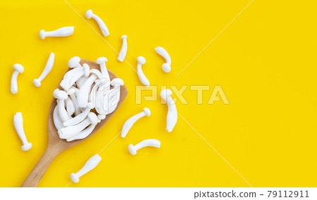White beech mushrooms, Shimeji mushroom, Edible mushroom on yellow background. 79112911
