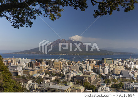 Sakurajima and downtown area taken from Shiroyama Observatory in Kagoshima City. 79115694