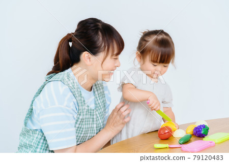 Girls and nursery teachers playing with toys Girls and nursery teachers playing with toys 79120483