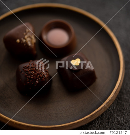 Bonbon chocolate on a plate Bonbon chocolate on a plate 79121247