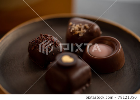Bonbon chocolate on a plate Bonbon chocolate on a plate 79121350