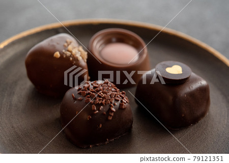 Bonbon chocolate on a plate Bonbon chocolate on a plate 79121351