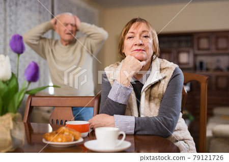 Offended elderly woman during quarrel with husband Offended elderly woman during quarrel with husband 79121726