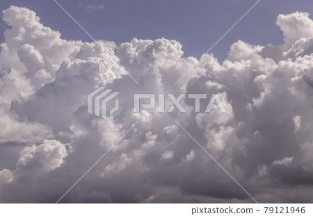The sun shines through the clouds in the sky. The shape of the clouds evokes imagination and creativity. The sun shines through the clouds in the sky. The shape of the clouds evokes imagination and creativity. 79121946