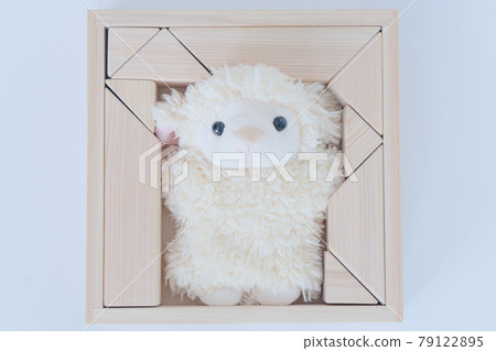 Stuffed sheep surrounded by building blocks 79122895