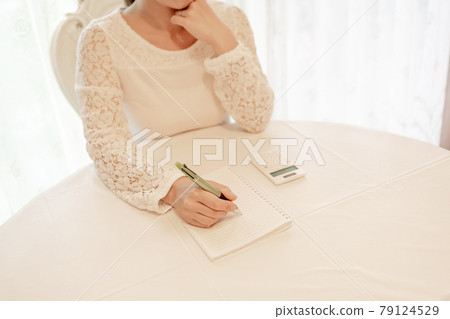 Pen, ballpoint pen, notebook, calculator, telework, home office work, writing qualification, study, thinking, cheek cane, female Pen, ballpoint pen, notebook, calculator, telework, home office work, writing qualification, study, thinking, cheek cane, female 79124529