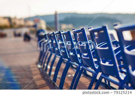 Blue chairs on the Promenade des Anglais in Nice, 79125214