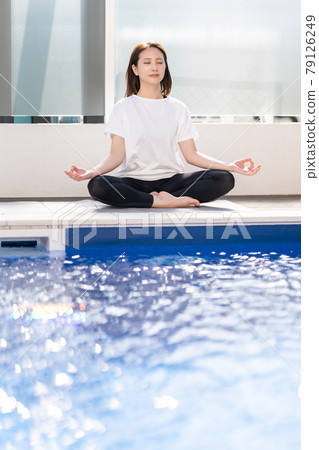 Yoga mantra meditation poolside Yoga mantra meditation poolside 79126249