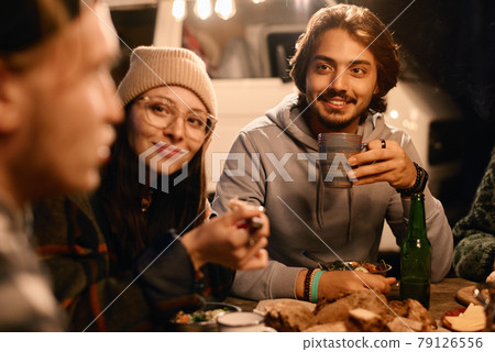 People having dinner outdoors People having dinner outdoors 79126556