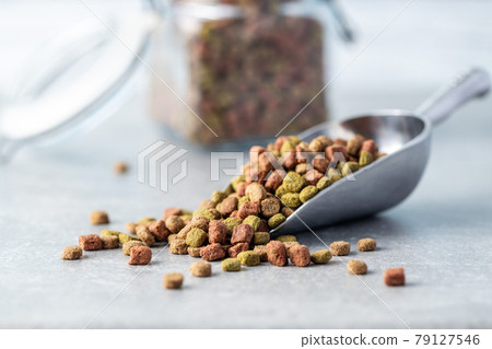 Dry kibble animal food. Dried food for cats or dogs. Dry kibble animal food. Dried food for cats or dogs. 79127546