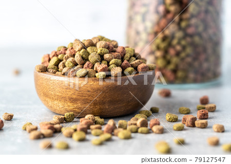 Dry kibble animal food. Dried food for cats or dogs. 79127547