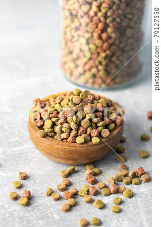 Dry kibble animal food. Dried food for cats or dogs. Dry kibble animal food. Dried food for cats or dogs. 79127550