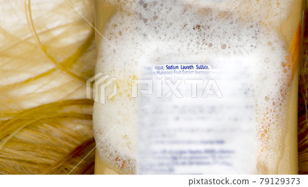 Sodium laureth sulfate (SLES). Composition of shampoo with sulfate on woman's hair Sodium laureth sulfate (SLES). Composition of shampoo with sulfate on woman's hair 79129373