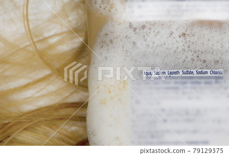 Sodium laureth sulfate (SLES). Composition of shampoo with sulfate on woman's hair 79129375