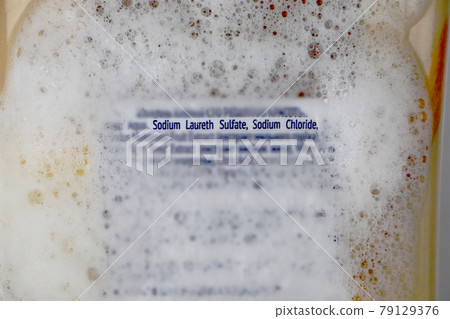 Sodium laureth sulfate (SLES). Composition of shampoo with sulfate on woman's hair 79129376