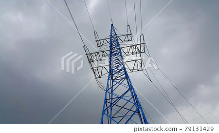 High voltage tower against the cloudy sky 79131429