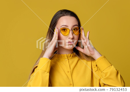 beautiful young blonde woman in orange sunglasses beautiful young blonde woman in orange sunglasses 79132453