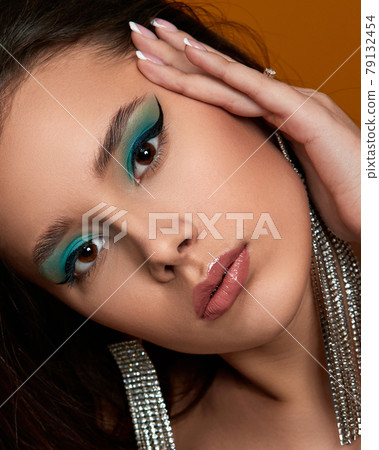 young woman with blue eye shadow makeup young woman with blue eye shadow makeup 79132454