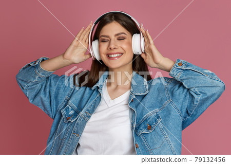 beautiful woman in headphones listening to music beautiful woman in headphones listening to music 79132456