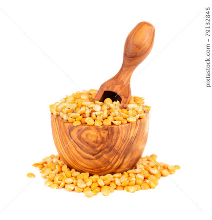 Dry yellow split peas in olive bowl and scoop, isolated on white background. Halves of yellow legume peas. Dry yellow split peas in olive bowl and scoop, isolated on white background. Halves of yellow legume peas. 79132848