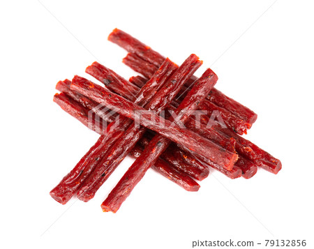 Dry salmon sticks isolated on white background. Dried fish snacks for beer. Dry salmon sticks isolated on white background. Dried fish snacks for beer. 79132856