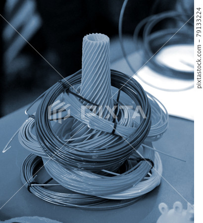 Figure and Skeins of Plastic for 3D printer. Production printed by 3d printer 79133224