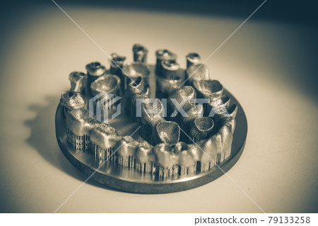 Object printed on metal 3d printer. Dental crowns Object printed on metal 3d printer. Dental crowns 79133258