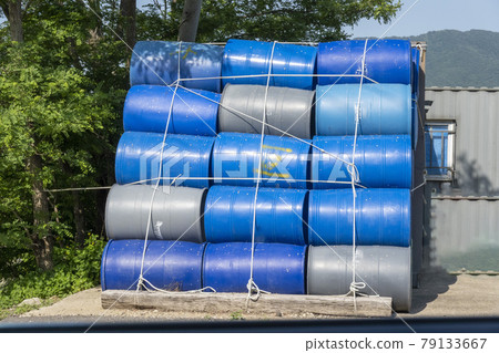 Drums stacked outdoors 79133667