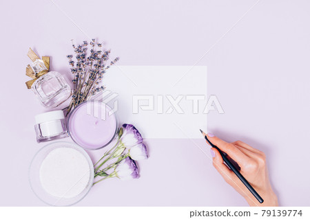 Top view of female hand holding pencil writes on blank card template 79139774