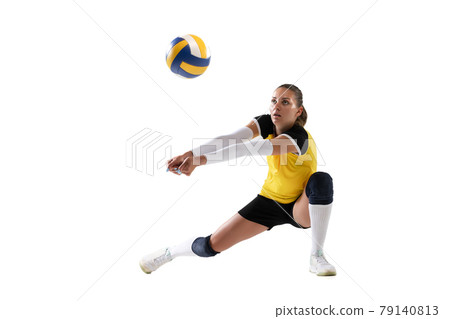 Female professional volleyball player with ball isolated on white studio background. The athlete, exercise, action, sport, healthy lifestyle, training, fitness concept. 79140813