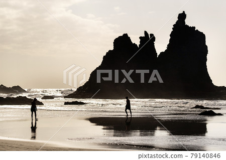 People on the sandy beach of Benijo on the island of Tenerife.Spain People on the sandy beach of Benijo on the island of Tenerife.Spain 79140846