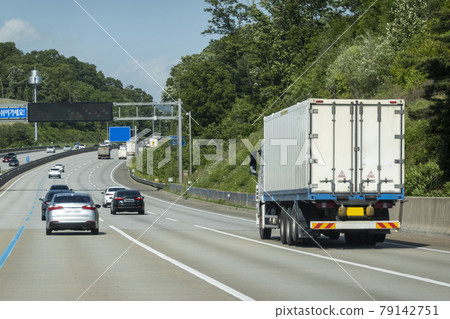 A truck driving on a highway A truck driving on a highway 79142751