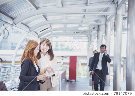 Business Partner using laptop online meeting team Partnership businessman, businesswoman talking together. Diversity Asian Business Partner online meeting trust teamwork. Asian Business team meeting. 79147079