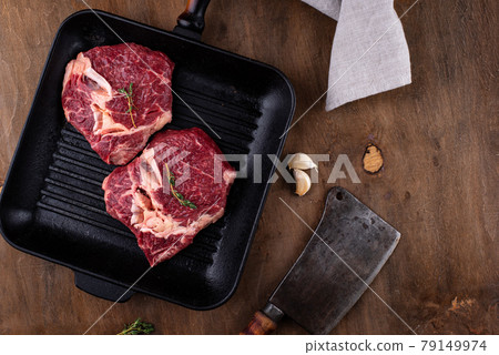 Raw uncooked rib eye steak 79149974