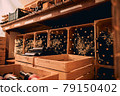Bottles of wine stored in wooden crates and wine racks 79150402