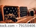Storage room with wine bottles in wooden crates 79150406