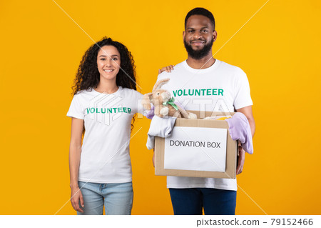 Volunteers Posing With Donation Box Peeking Clothes For Charity, Studio 79152466