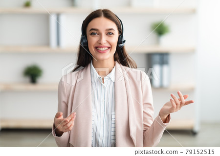 Portrait Of Hotline Operator Lady Wearing Headset Talking In Office 79152515