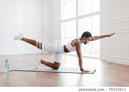 Happy African Woman In Sportswear Doing Balance Exercise Happy African Woman In Sportswear Doing Balance Exercise 79152611