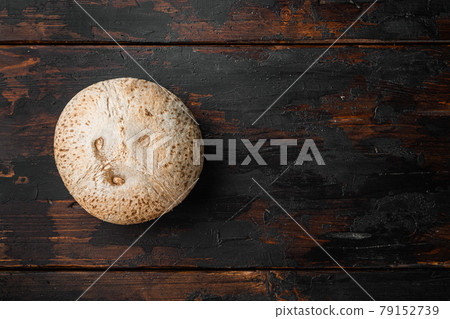 Freshly harvested coconut, on old dark wooden table background, top view flat lay, with copy space for text Freshly harvested coconut, on old dark wooden table background, top view flat lay, with copy space for text 79152739
