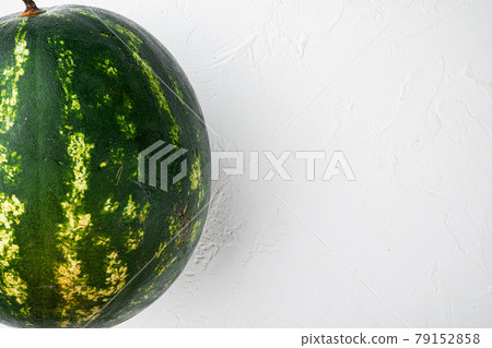 Watermelon whole, on white stone table background, with copy space for text 79152858
