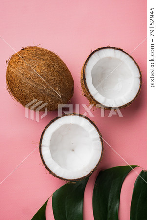 Coconut slices, on pink textured summer background, top view flat lay Coconut slices, on pink textured summer background, top view flat lay 79152945