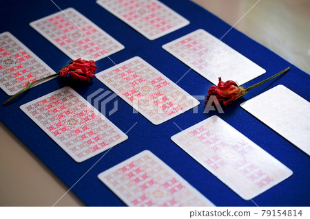 Defocused mystic ritual with tarot cards, and candles. Defocused mystic ritual with tarot cards, and candles. 79154814